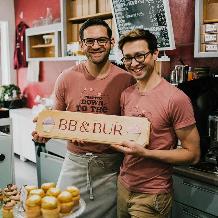 Two men stand in a bakery